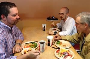 Steve King, Bryan Whitchurch and Bernard Sheehan speaking Latin over lunch at the Conventiculum Latinum. Photo by Heather Chapman